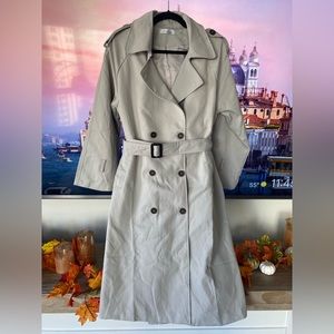 Double breasted beige trench coat